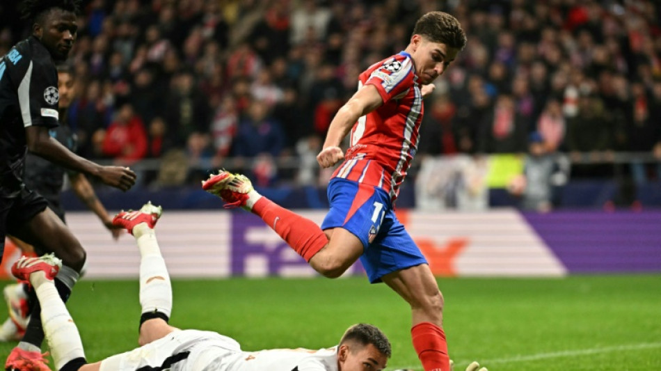 Alvarez sends Atletico past Leverkusen late as both sides see red