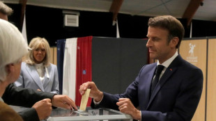 Macron battles French left in tight parliament election