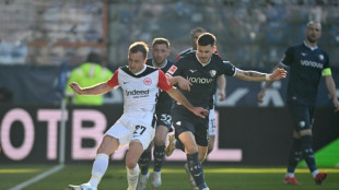 Frankfurt beat Bochum and 50-minute delay to boost Champions League bid