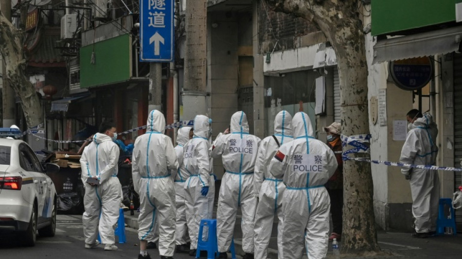 Hazmat suits and panic buying: pandemic images return to China