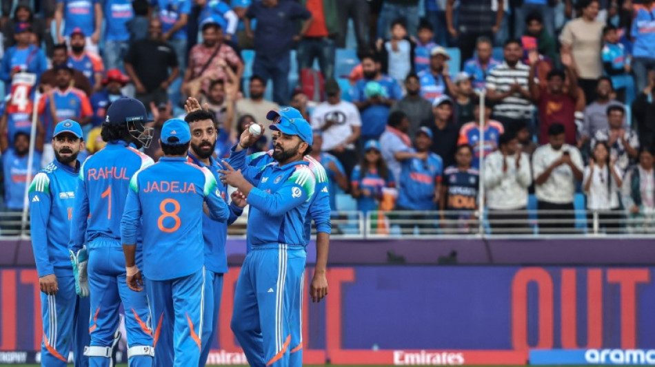 Chakravarthy stars as India set up Champions Trophy clash with Australia