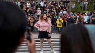 At a Jakarta crosswalk, Indonesian teens take to the catwalk