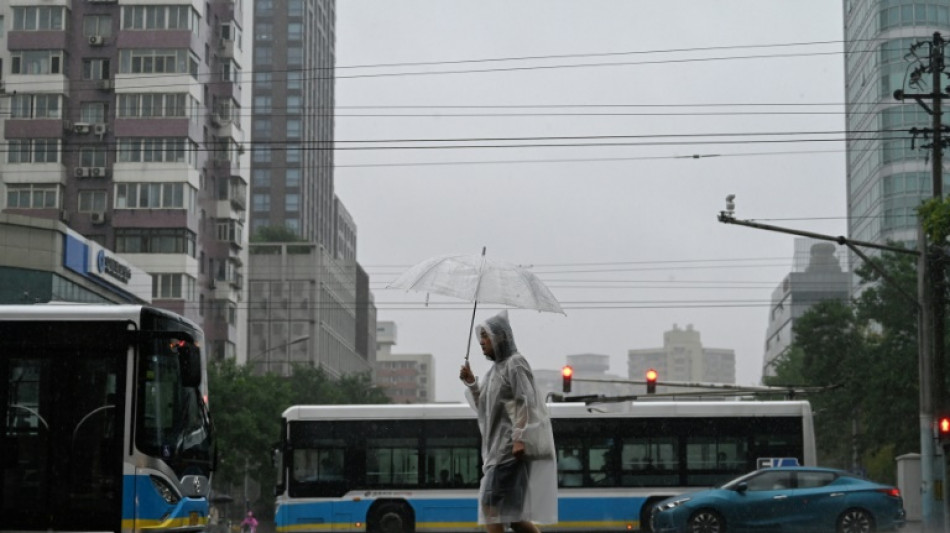 Raging storm washes away cars, swathes of northern China on red alert