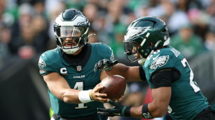 Eagles clinch NFL playoff spot but Vikings left on the brink